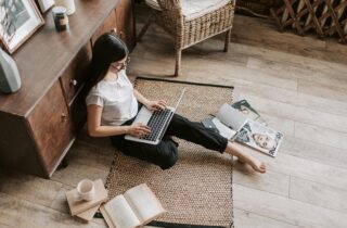 Photo by Vlada Karpovich: https://www.pexels.com/photo/confident-young-businesswoman-with-laptop-and-notebook-sitting-on-floor-modern-apartment-4050351/